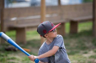 Boy swinging plastic baseball bat