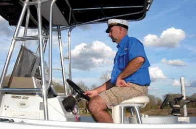 Captain at helm of fishing boat