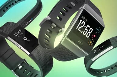 Fitbit watches on green background