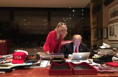 Donald Trump plays on his laptop in his office