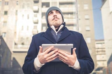 White guy on Facebook holding iPad