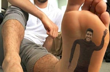 Man with tattoo of another man on the bottom of his foot