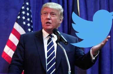 Donald Trump holding Twitter icon in his hand at a podium