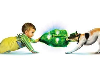 Son of the Mask baby and dog tug of war on a green mask