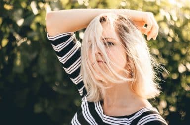 Woman with hand in her blonde hair