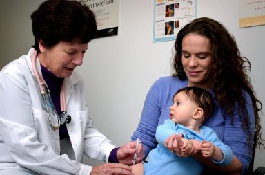 parents taking their kid to the doctor