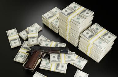 money and gun for the mob guys