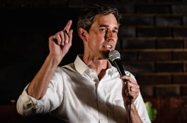 Beto O'Rourke with a microphone