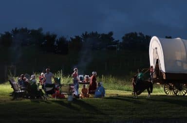 Amish party games at night by the wagon