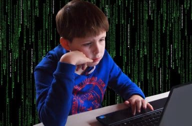 the young kid hacker is in the computer and on the mainframe
