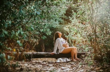 Pregnant woman in the woods