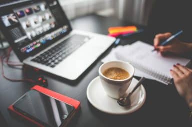 Laptop and a phone on the table for a freelancer