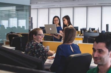 Office coworkers at a cubicle