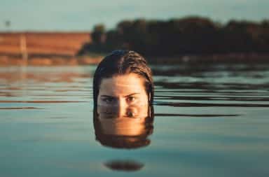 Woman halfway face in water