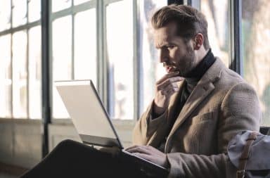 Confused man at his laptop