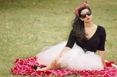 Red picnic blanket and head scarf on a woman