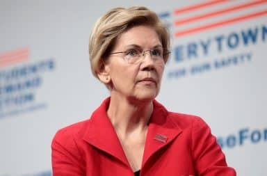 Elizabeth Warren looking pensive on stage