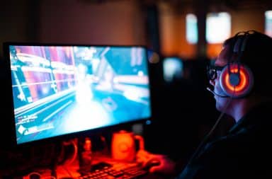 Quarantine video gaming man in front of computer