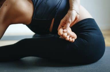 Yoga inside during quarantine woman