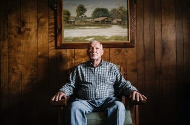 Dad sitting in a chair being interrogated