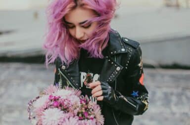 Leather jacket on a woman with purple hair