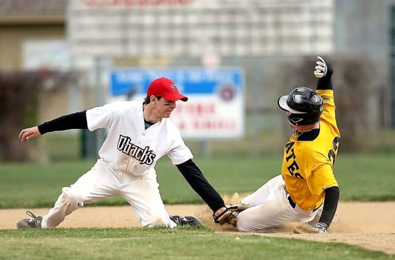 Baseball tagging someone out at second base