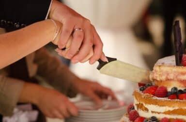 slicing the wedding cake