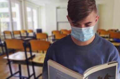 student with a mask
