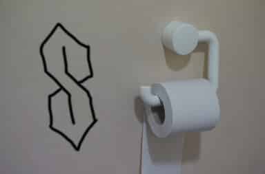 cool s on the bathroom wall