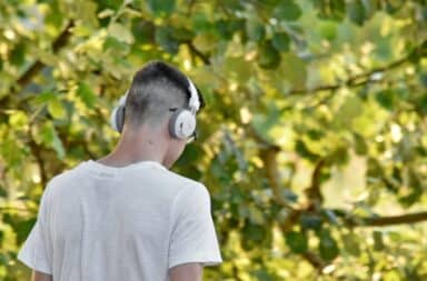 guy listening to music outside