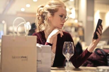 lady with wine and phone