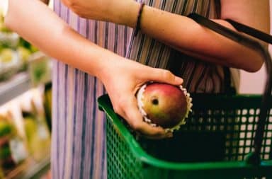 grocery hand basket with apple