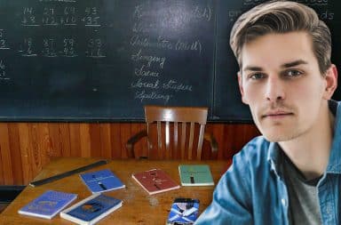 guy school in front of chalkboard