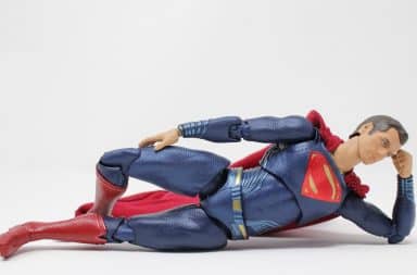 Superman lying down casually