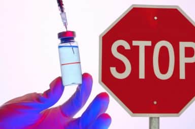 Stop sign and vaccine needle