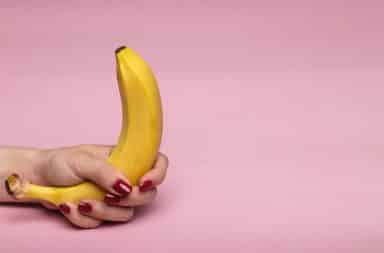 Banana held by hand