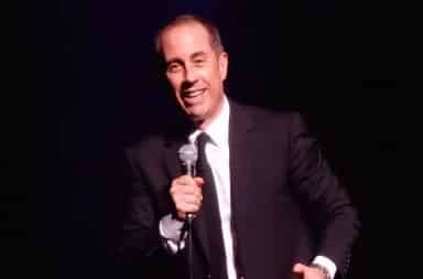 Jerry Seinfeld on stage performing