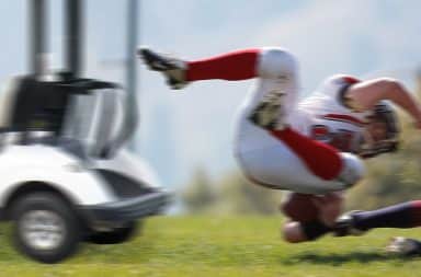 golf cart hitting a football guy
