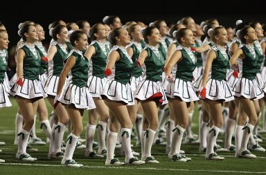 Cheerleaders in green chanting