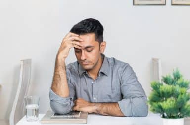 sad guy at a table