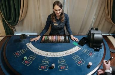 Poker dealer facing the card table