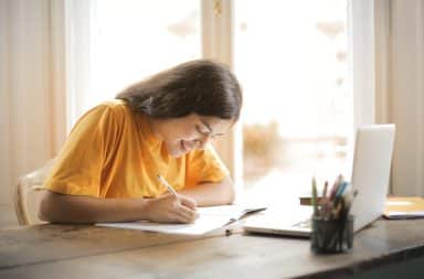 Woman at desk sitting working