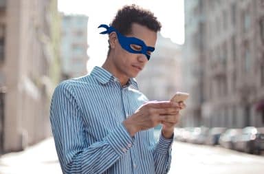 guy in a mask texting
