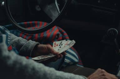 Cards in car hand in hand
