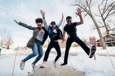 Kids jumping up outside