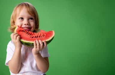 kid eats watermelon