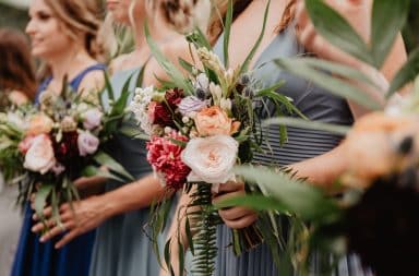 bridesmaids in dresses with flowers