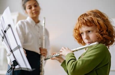 kid playing flute