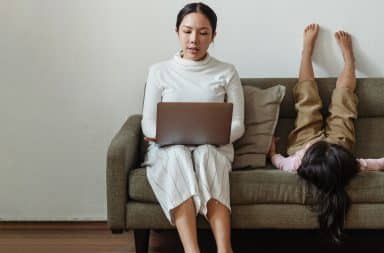 woman laptop kid couch