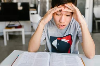 shocked kid at a book